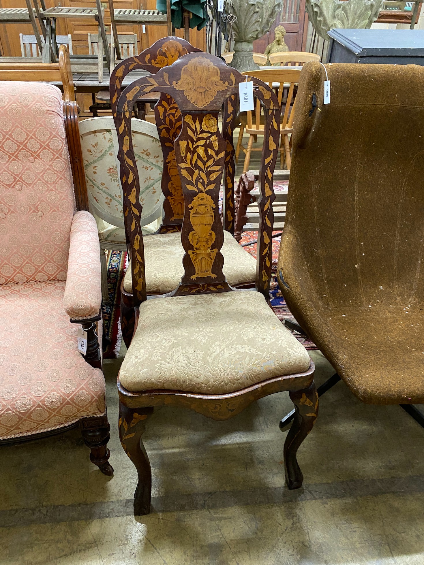 A pair of late 18th century Dutch walnut and marquetry dining chairs